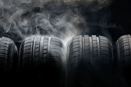 Car tires and smoke on black backgroundの写真素材