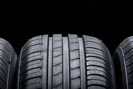Car tires on black backgroundの写真素材