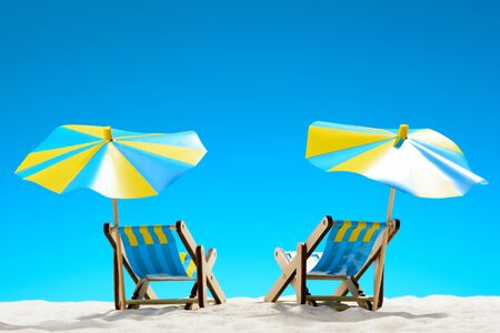 Two sunbeds at the beach on background of blue skyの写真素材