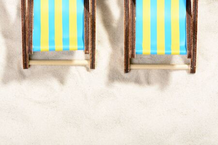 Two sunbeds on the beach: top viewの写真素材