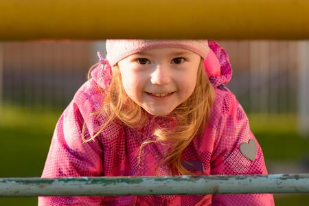 Little girl playing on the Playgroundの写真素材