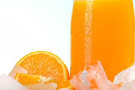 The bottle of orange juice on iceの写真素材