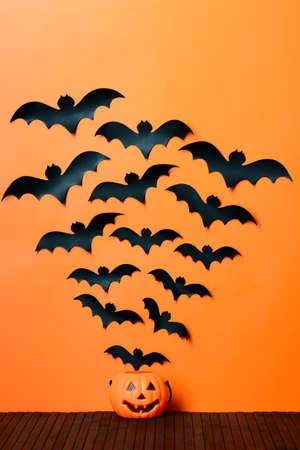 Paper bats fly out of his head Halloween pumpkinの写真素材