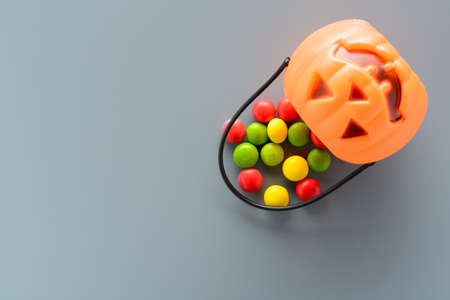 Halloween pumpkin bucket with candyの写真素材