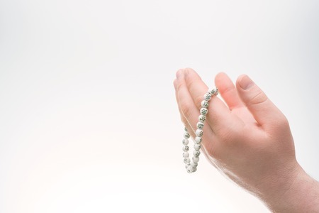 Hands with Muslim beads. Man prayingの写真素材