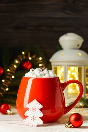 Marshmallows in a red mug with Christmas and New Year decorations. Holiday concept.の写真素材