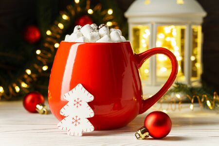 Marshmallows in a red mug with Christmas and New Year decorations. Holiday concept.の写真素材
