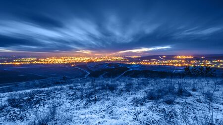 View from the hill on a winter city. Toning in trendy color 2020 classic blue.の写真素材
