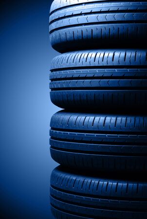 Four car summer tires in dramatic lighting. Toning in trendy color 2020 classic blue.の写真素材
