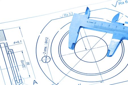 Measuring and drawing instruments and drawings on the table. Toning in trendy color 2020 classic blue.の写真素材