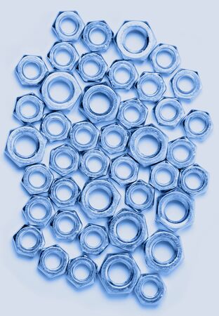 Nuts of different sizes on a white background. Toning in trendy color 2020 classic blue.の写真素材