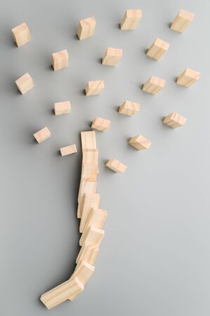 Stop coronavirus. Keep social distance to stop the domino effect. Preventive measures to combat the global spread of the pandemic. Vertical orientation, copy space.の写真素材