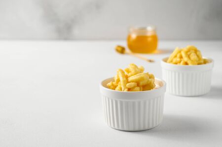 National food cuisine of the Middle East. Two ramekin with chak chak on a white table. Horizontal orientation, copy space.の写真素材