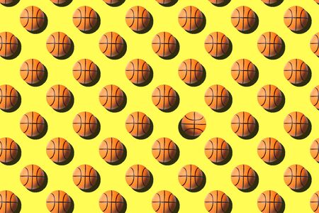 Basketball balls seamless pattern on bright yellow background.の写真素材