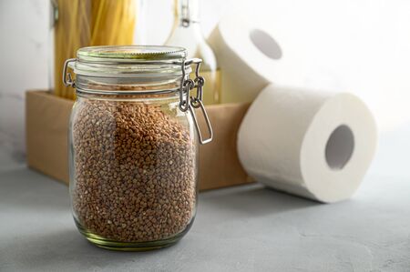 Donation box on the table. Food Delivery Concept. Jars with various cereals in a cardboard box. Copy space.の写真素材