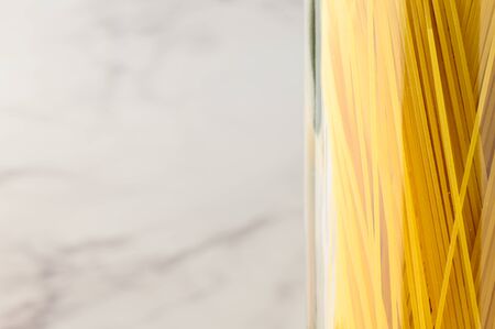 Spaghetti in a glass jar. Close-up, copy space.の写真素材