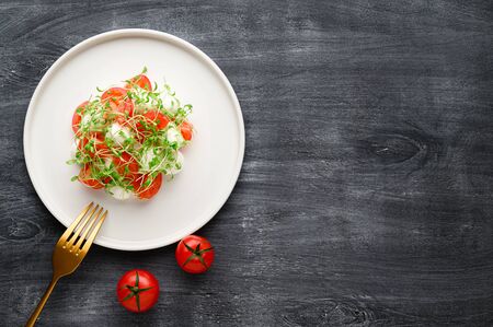 Caprese is a traditional Italian vegetable salad with mozzarella cheese, cherry tomatoes and arugula...