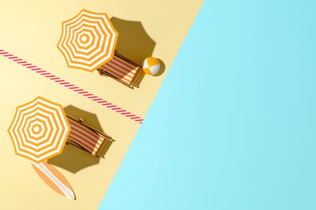 Top view of beach with sunbeds and umbrellas time after coronavirus pandemic. Two sun loungers with umbrellas, separated by marking line. New normal. Keep safe social distance. Copy space, horizontal.の写真素材