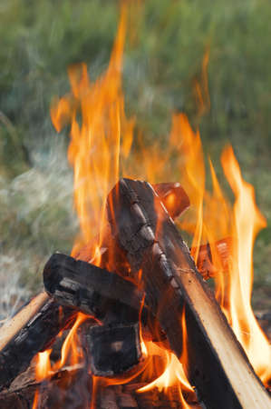Burning bonfire in nature during the camping. Vertical orientation, close-up.の写真素材
