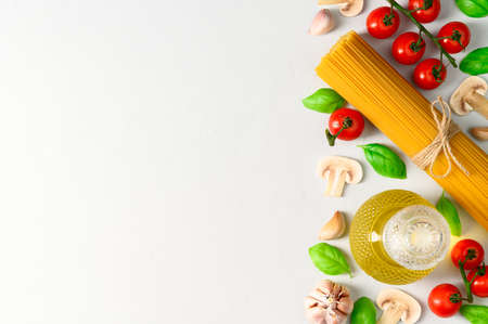 Set of products for cooking Italian pasta with mushrooms on a light gray background. Flat lay with place for text.の写真素材