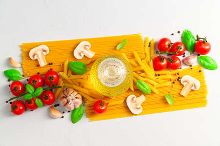 Set of products for cooking Italian pasta with mushrooms on a light gray background. Flat lay.の写真素材