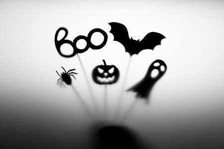 Halloween Decoration. Terrifying Shadow Puppets. Shadows pumpkin, bat, ghost, spider, and Boo word on the gray background.の写真素材