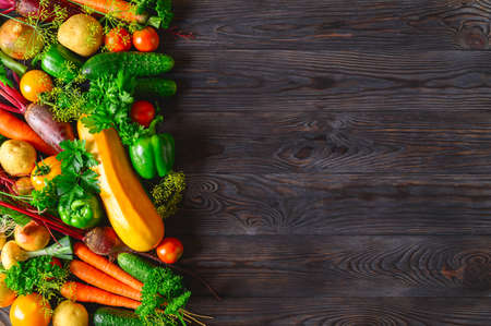 Eco food concept. Various fresh vegetables on dark wooden background. healthy food clean eating....
