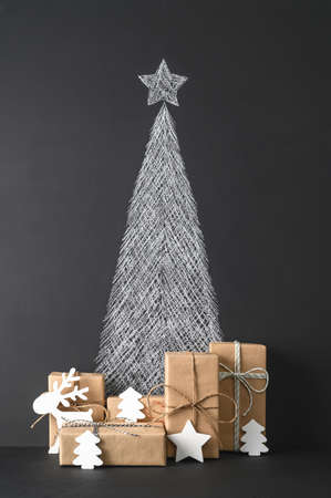 Creative Alternative Christmas tree. Christmas background with chalkboard and presents. vertical orientation. Minimal style.の写真素材