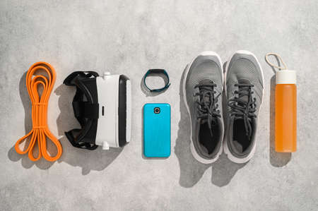 Fitness, workout, and VR technology concept. Sports equipment on gray backgroundの写真素材