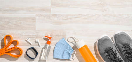 Safe fitness, workout concept. Sports equipment on the wooden floorの写真素材