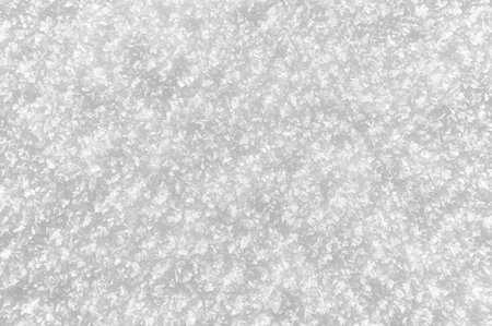 Snowy white background. Close-up snowflakes texture.の写真素材