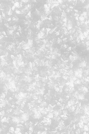 Snowy white background. Close-up snowflakes texture.の写真素材