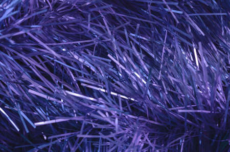 Christmas background, the texture of shiny tinsel. Toned in trendy Color Of The Year 2022 - Very Peri.の写真素材