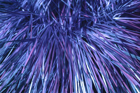 Christmas background, the texture of shiny tinsel. Toned in trendy Color Of The Year 2022 - Very Peri.の写真素材