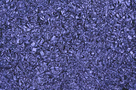Abstract textured background from crumpled aluminum foil. Toned in trendy Color Of The Year 2022 - Very Peri.の写真素材