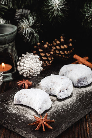 Traditional Greek Kourabiedes with Christmas Decorations: Festive Holiday Cookies on a Rustic Wooden Table.の写真素材