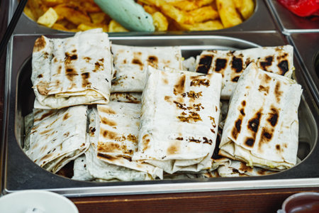 Turkish Kebab Roll: Grilled Chicken in Lavash at a Street Food Festival.の写真素材