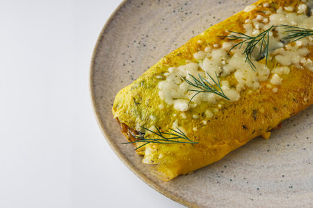 Delicious Homemade Omelette: Fresh Ingredients with Cheese, Mushrooms, and Vegetables.の写真素材