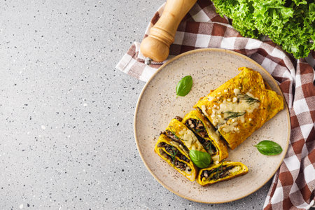 Delicious Homemade Omelette: Fresh Ingredients with Cheese, Mushrooms, and Vegetables.の写真素材
