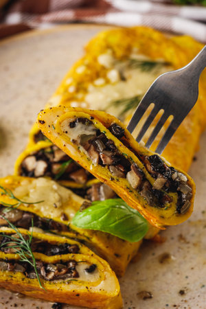 Delicious Homemade Omelette: Fresh Ingredients with Cheese, Mushrooms, and Vegetables.の写真素材