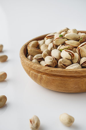 Fresh Pistachios: Nutritious Green Nuts on a White Background.の写真素材