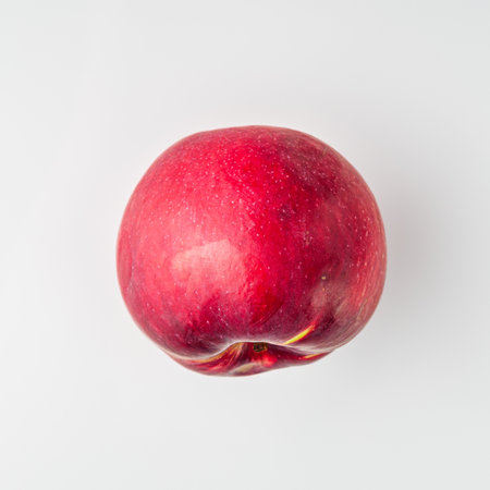 Juicy Red Apple: Fresh and Delicious Fruit Isolated on White Background.の写真素材