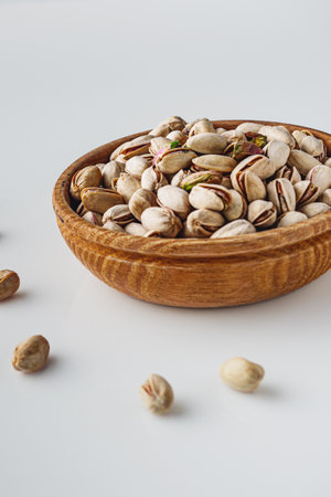 Fresh Pistachios: Nutritious Green Nuts on a White Background.の写真素材