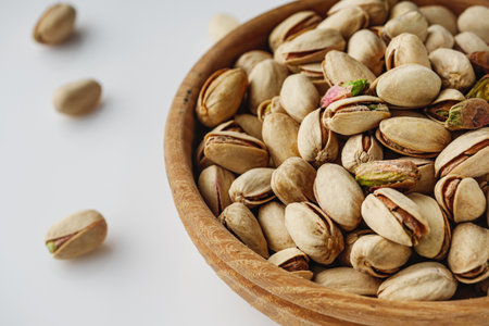 Fresh Pistachios: Nutritious Green Nuts on a White Background.の写真素材