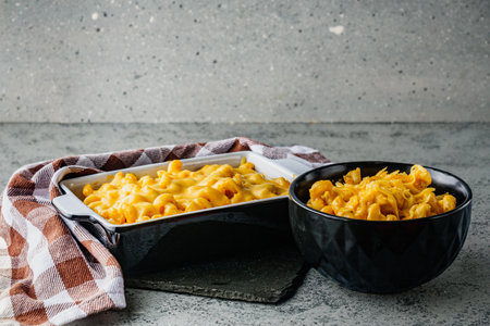 Delicious Homemade Cheddar Mac and Cheese in a Bowl with Creamy Sauce and Tasty Noodles.の写真素材