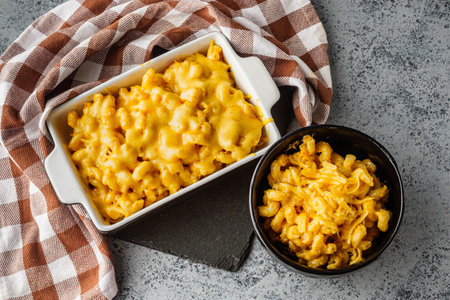 Delicious Homemade Cheddar Mac and Cheese in a Bowl with Creamy Sauce and Tasty Noodles.の写真素材