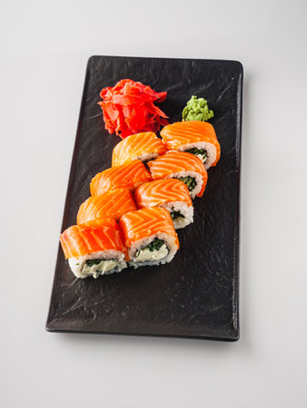 Fresh Sushi Rolls with Salmon and Tuna, Japanese Cuisine on a Gourmet Seafood Plate.の写真素材