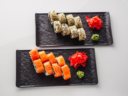 Fresh Sushi Rolls with Salmon and Tuna, Japanese Cuisine on a Gourmet Seafood Plate.の写真素材