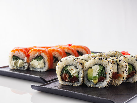 Fresh Sushi Rolls with Salmon and Tuna, Japanese Cuisine on a Gourmet Seafood Plate.の写真素材