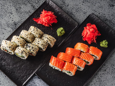 Fresh Sushi Rolls with Salmon and Tuna, Japanese Cuisine on a Gourmet Seafood Plate.の写真素材